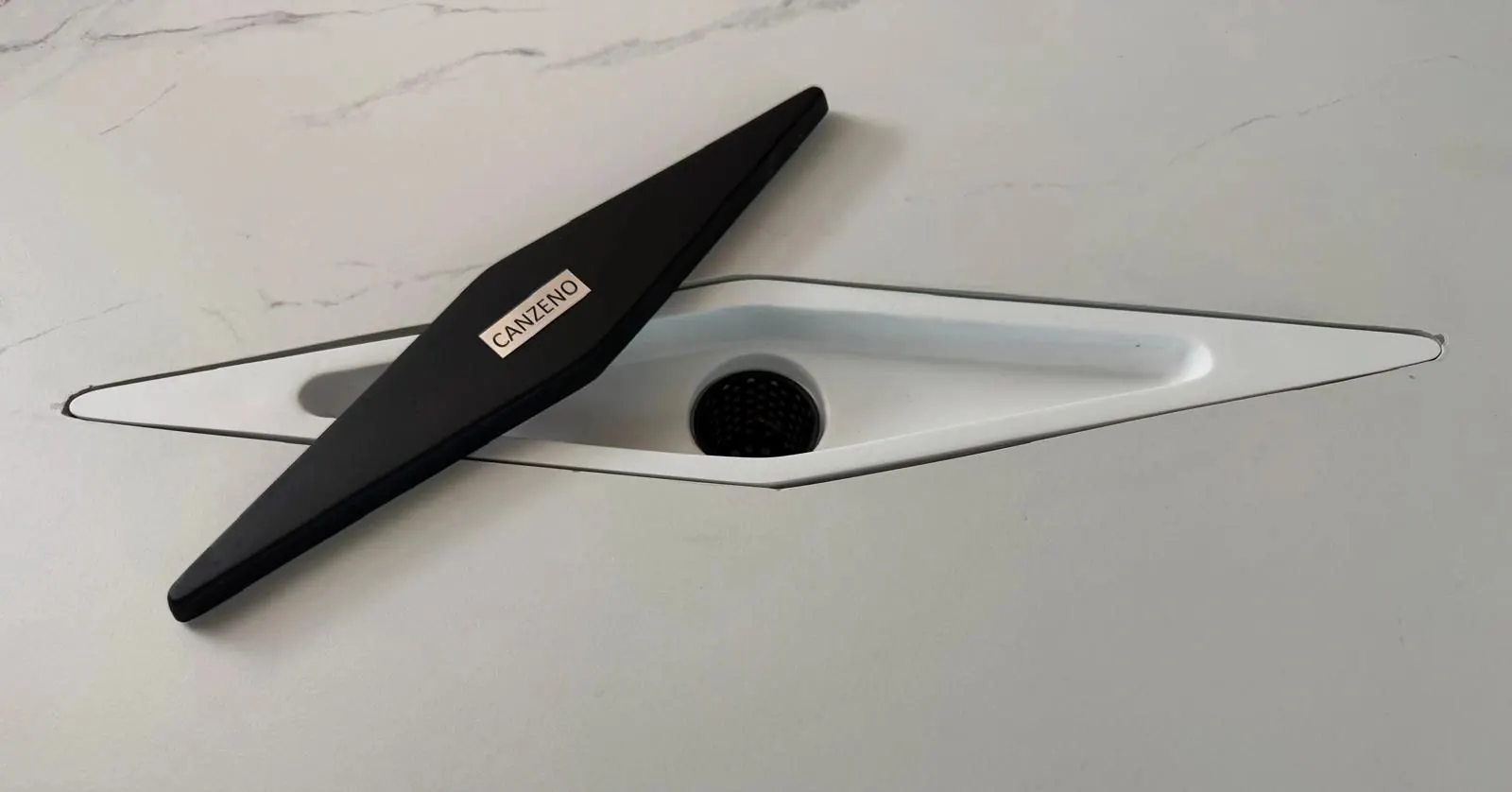 Canzeno Diamond Drain with the black cover lifted, showing the drain body