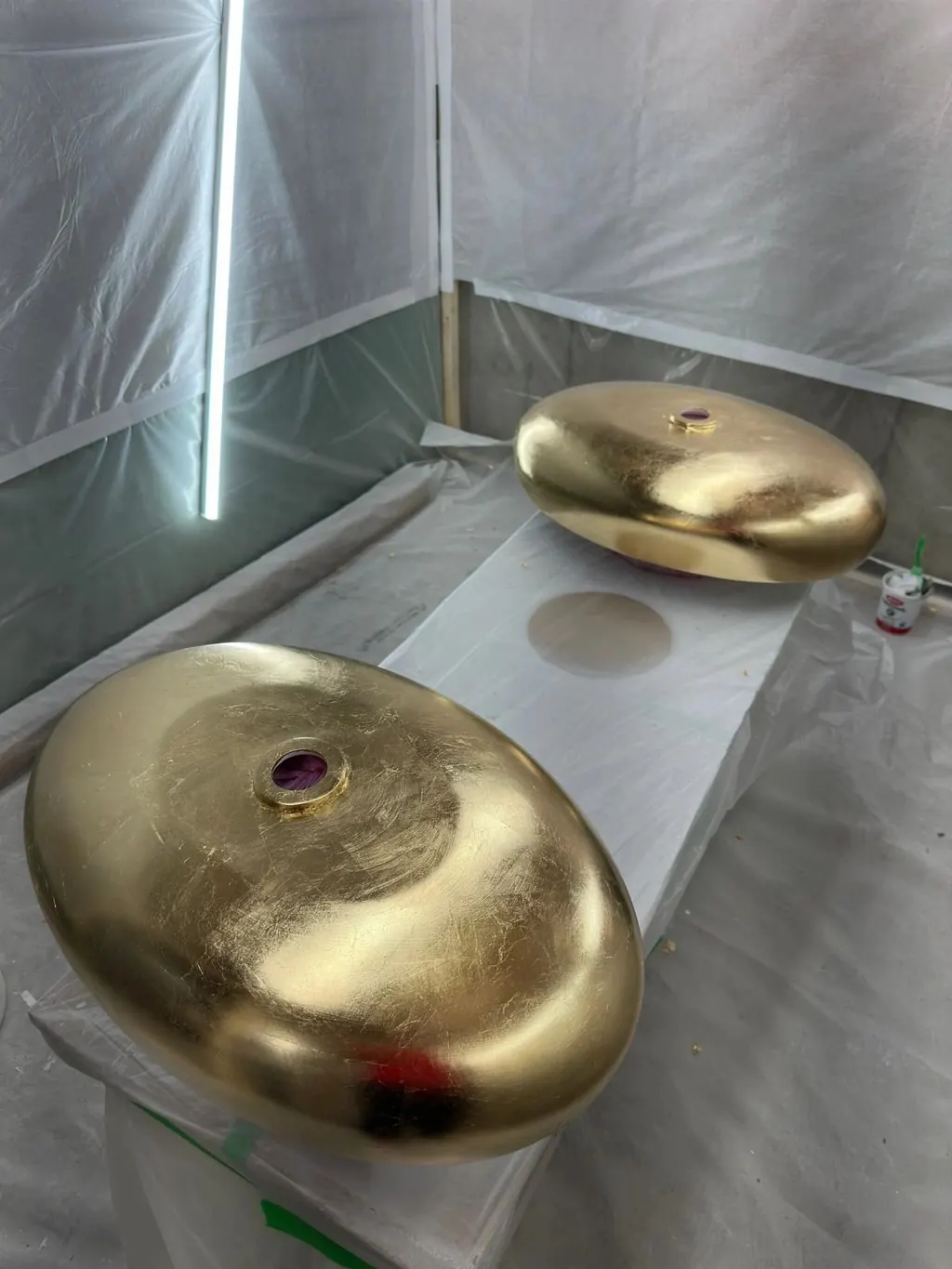 Two hand-finished gold vessel sinks from the Canzeno Artistic Collection, in the workshop