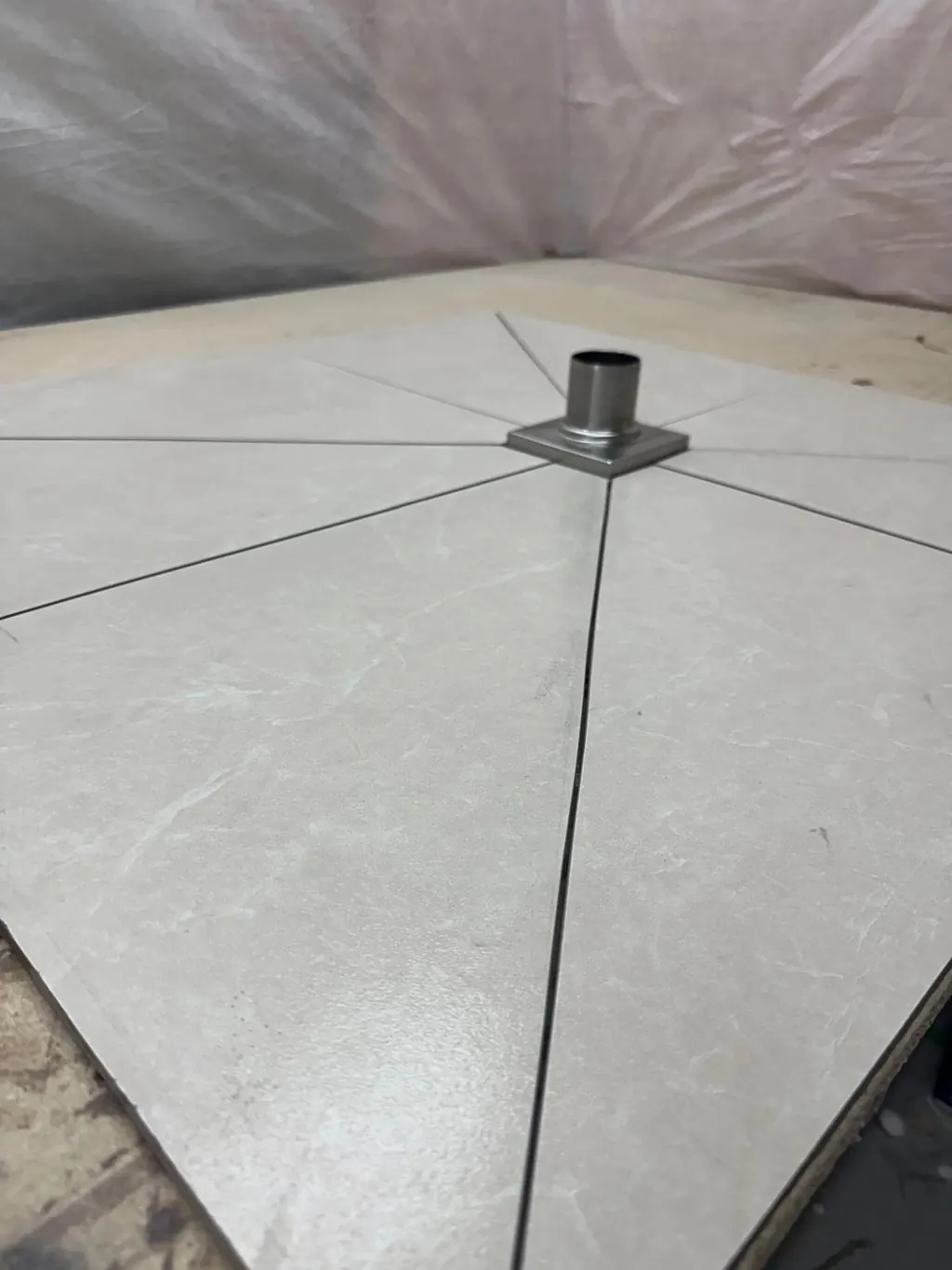Canzeno tiled shower base finished in the shop before delivery, with the drain flange in place