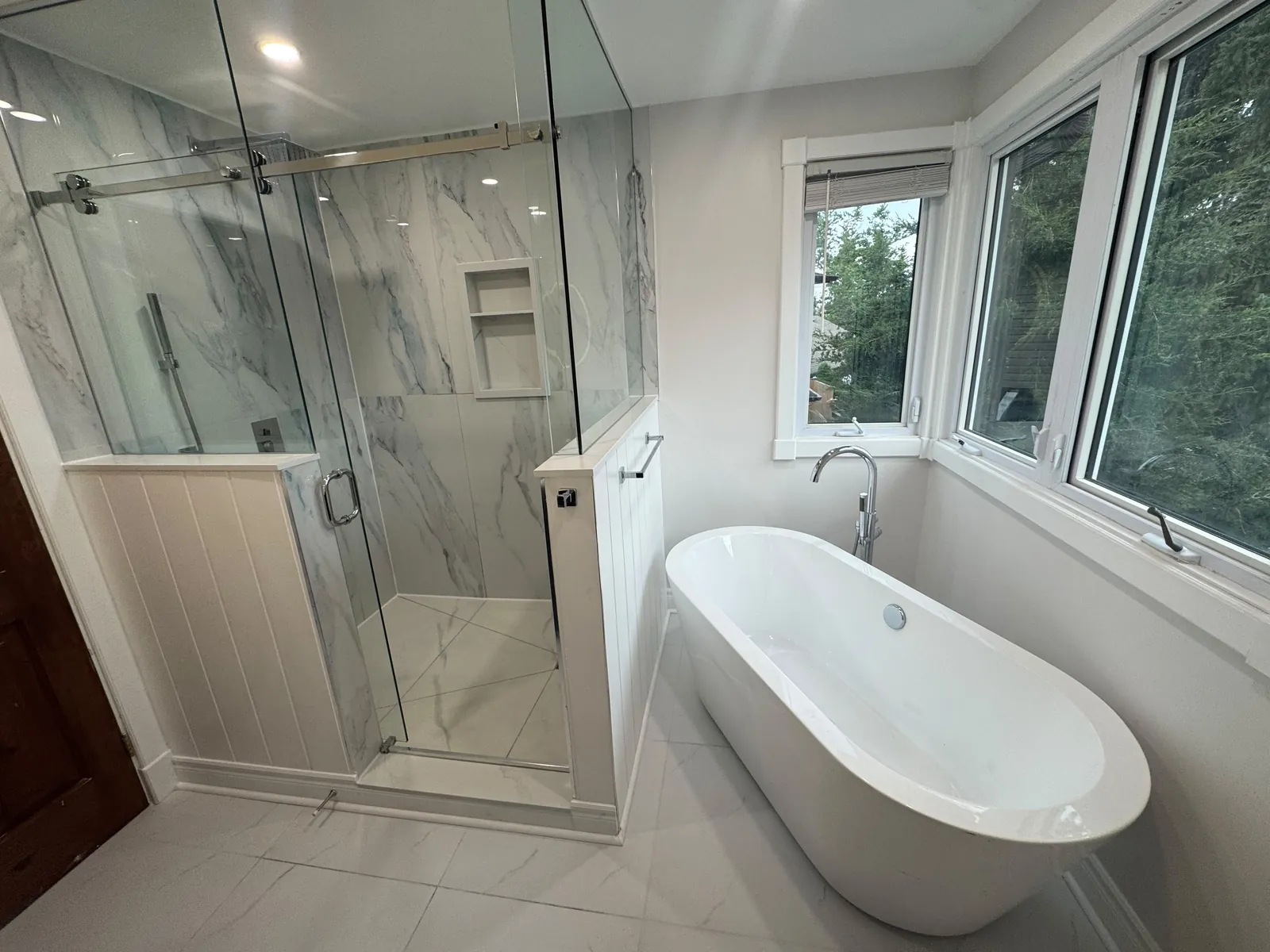Full bathroom renovation in Whitby by Canzeno, glass shower and freestanding tub